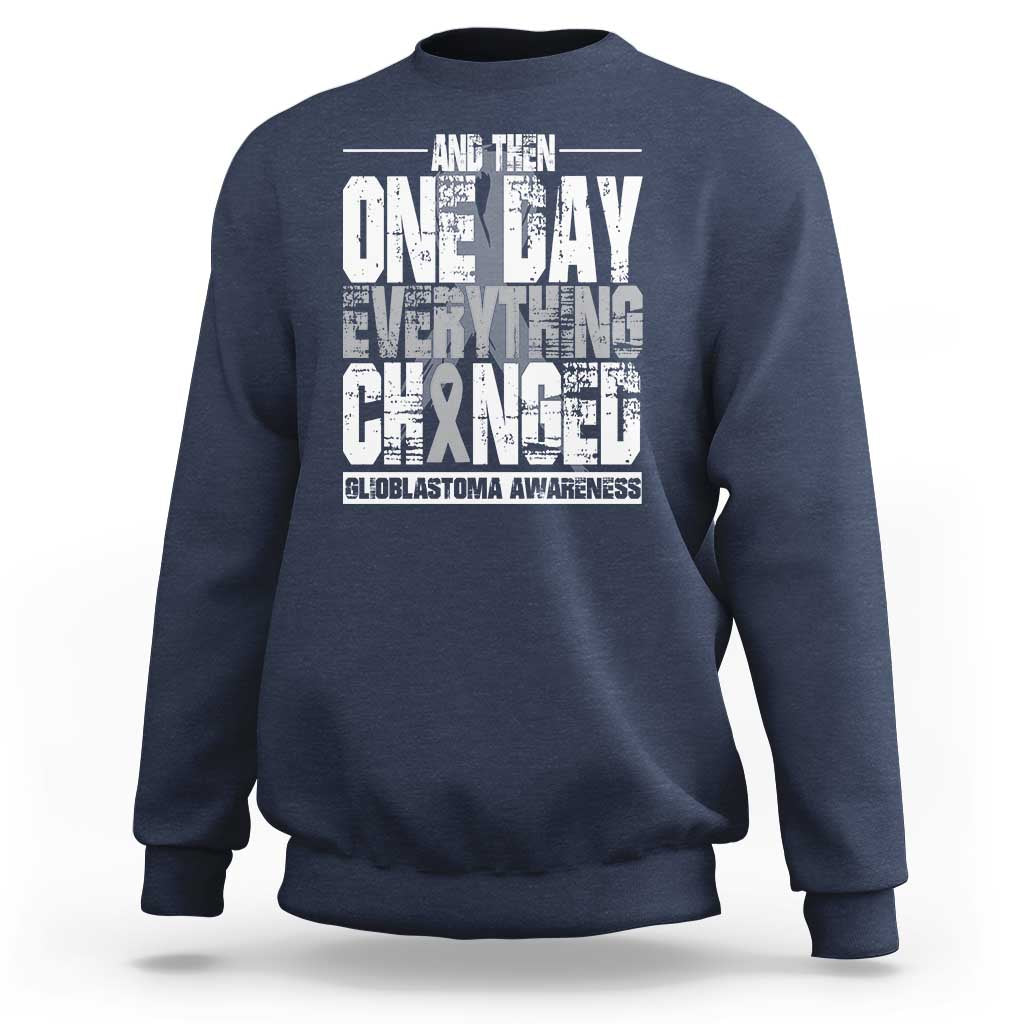 Navy crewneck sweatshirt with white glioblastoma awareness quote graphic on back