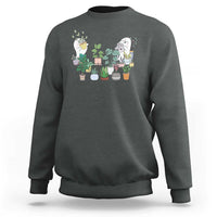 Dark heather Halloween gardener sweatshirt with garden gnome graphic and potted plants on chest