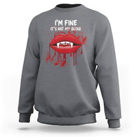 Charcoal gray vampire lip graphic sweatshirt with “I’m fine, It’s not my blood” text