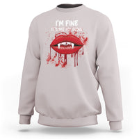 Pale gray vampire lip graphic sweatshirt with “I’m fine, It’s not my blood” text