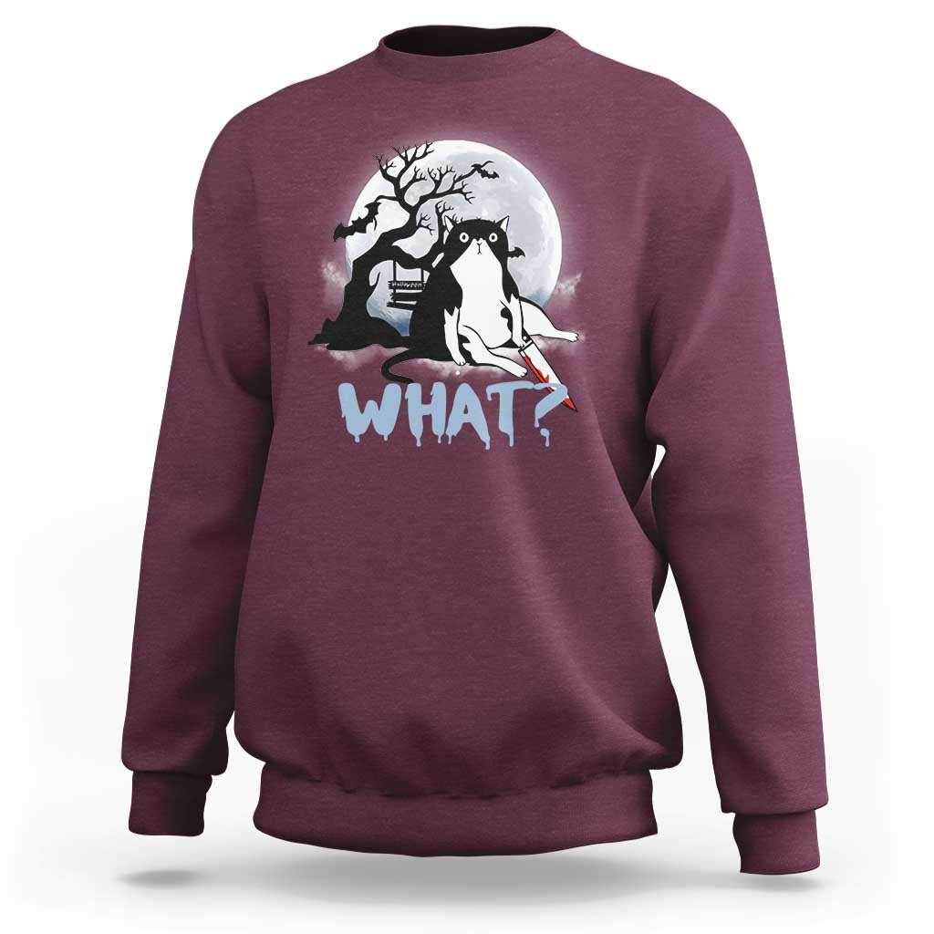 Maroon crewneck sweatshirt with long sleeves; cat graphic and "WHAT?" print at chest.