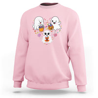 Pink crewneck sweatshirt with cute ghost trio and candy swirl graphic