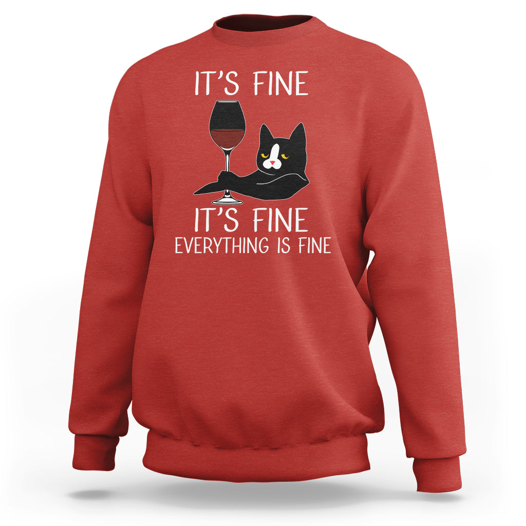 Red crewneck cat lover sweatshirt with “It's fine” text and wine glass cat graphic