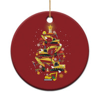 Red circular Christmas ornament with stack of yellow construction vehicles and star topper
