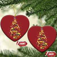 Red heart-shaped Christmas ornaments with yellow construction-vehicle tree design; FRONT and BACK