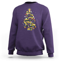 Purple crewneck sweatshirt with colorful monster-truck Christmas tree graphic