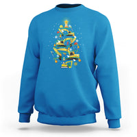 Blue crewneck sweatshirt with colorful monster-truck Christmas tree graphic