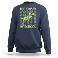 Boys navy sweatshirt with 100 Days of School dinosaur graphic on front.