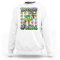 Boys white sweatshirt with 100 Days of School dinosaur graphic on front.