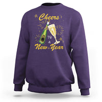 Purple crewneck sweatshirt with 'Cheers to a New Year' graphic and fireworks