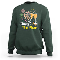 Dark forest green crewneck sweatshirt with “Cheers to the New Year” fireworks and champagne glasses print