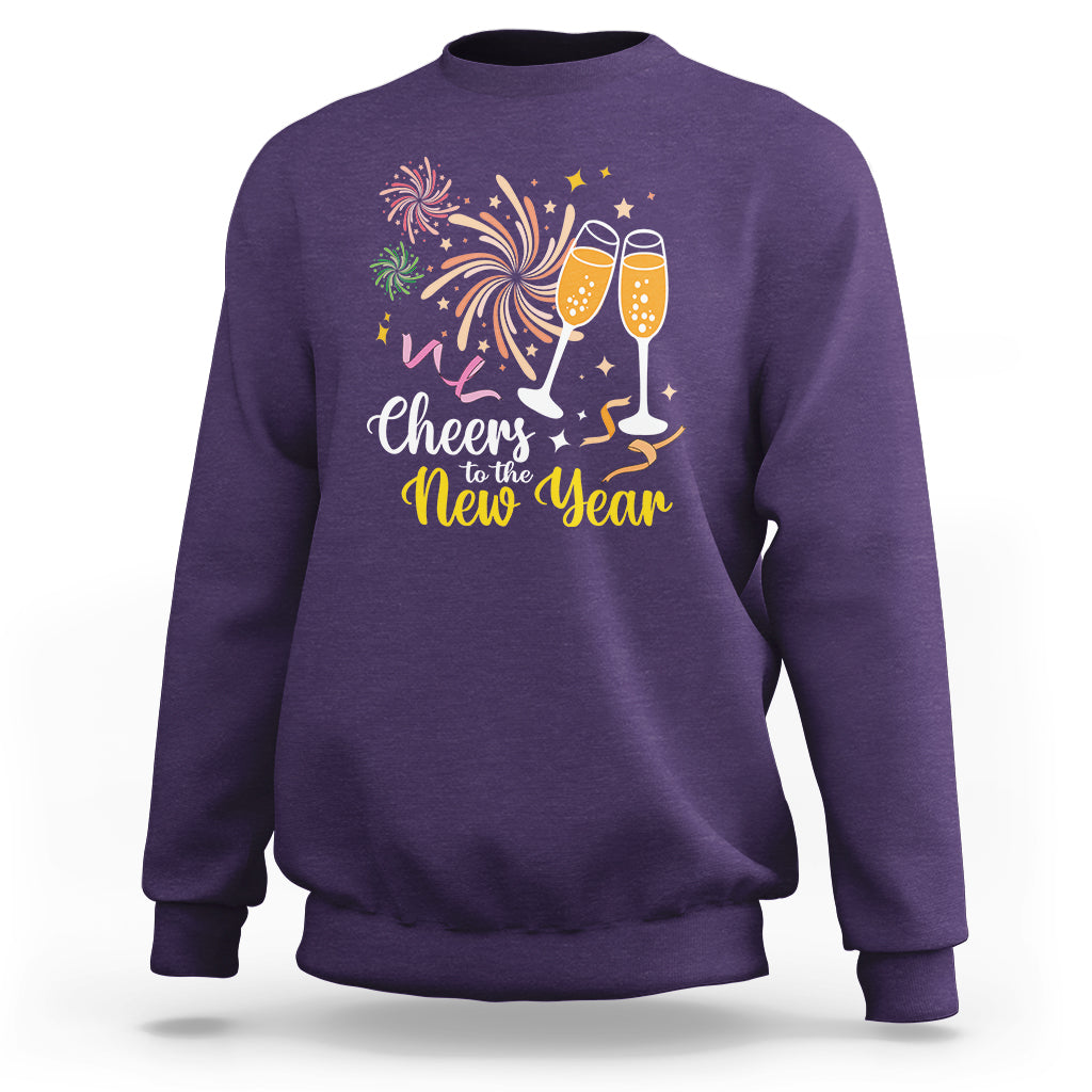 Purple crewneck sweatshirt with “Cheers to the New Year” fireworks and champagne glasses print