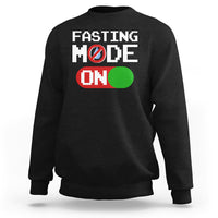 Black sweatshirt with 'FASTING MODE ON' graphic on chest