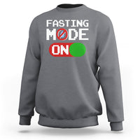 Charcoal gray sweatshirt with 'FASTING MODE ON' graphic on chest