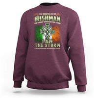 Maroon crewneck sweatshirt with Irish cross storm graphic on front