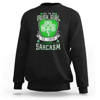 Black crewneck sweatshirt with centered clover graphic and slogan print