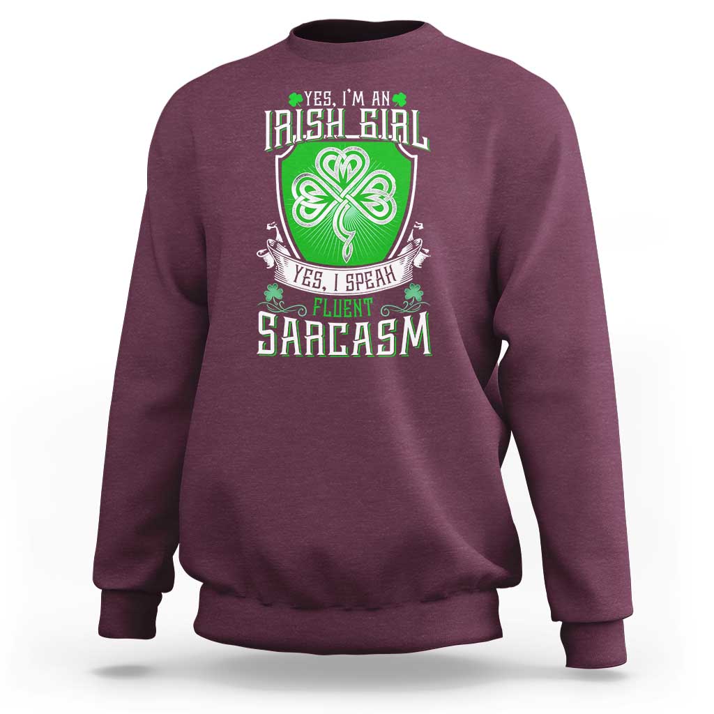 Maroon crewneck sweatshirt with centered clover graphic and slogan print