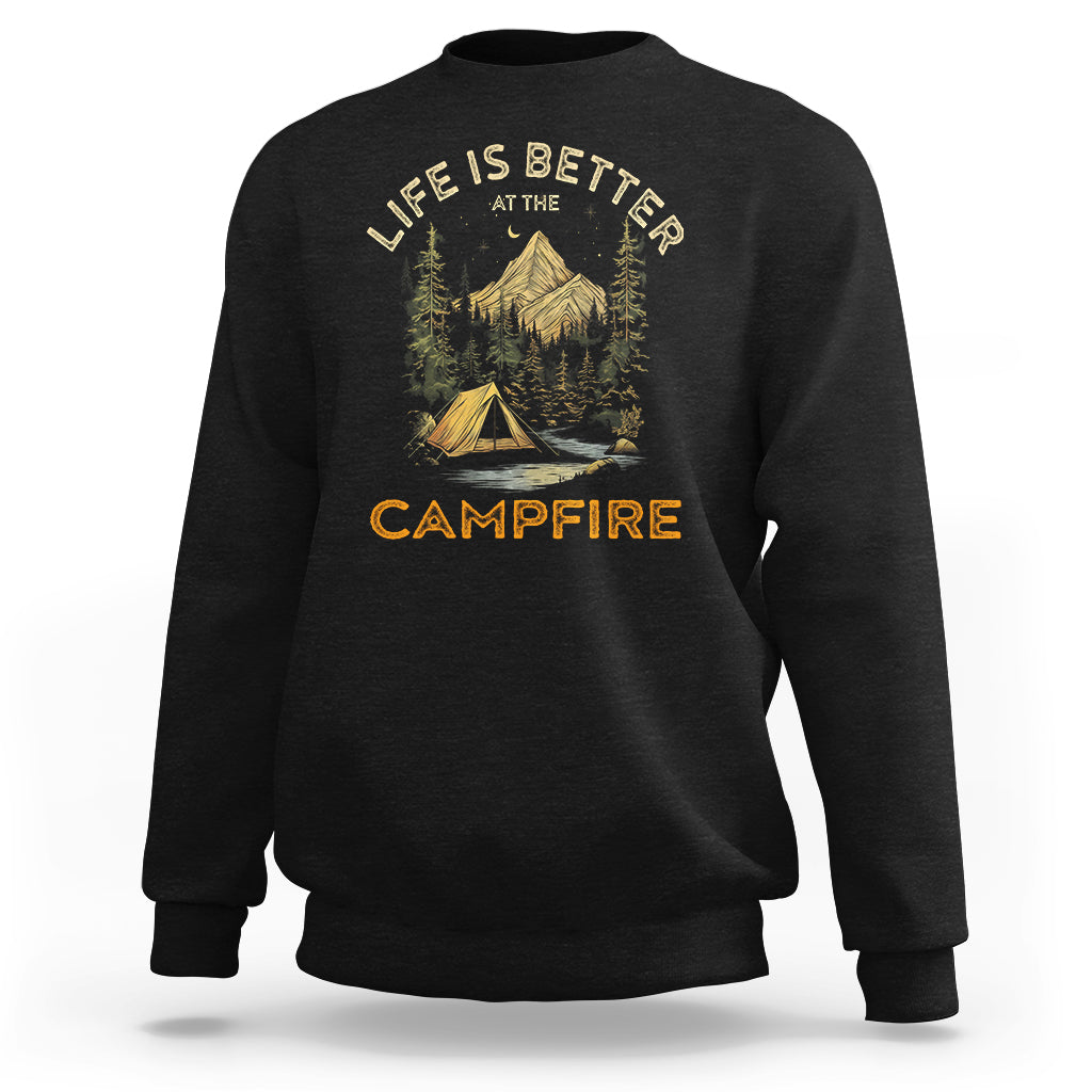 Black crewneck sweatshirt with campfire scene and “Life is better” text graphic