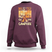 Maroon crewneck sweatshirt with “Master of the Campfire” campfire graphic on chest