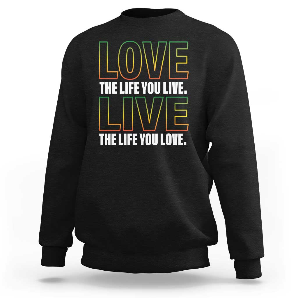 Black crewneck sweatshirt with colorful "LOVE" quote graphic on front