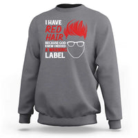 Gray crewneck sweatshirt with red “I have red hair” warning graphic on back