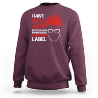 Maroon crewneck sweatshirt with red “I have red hair” warning graphic on back