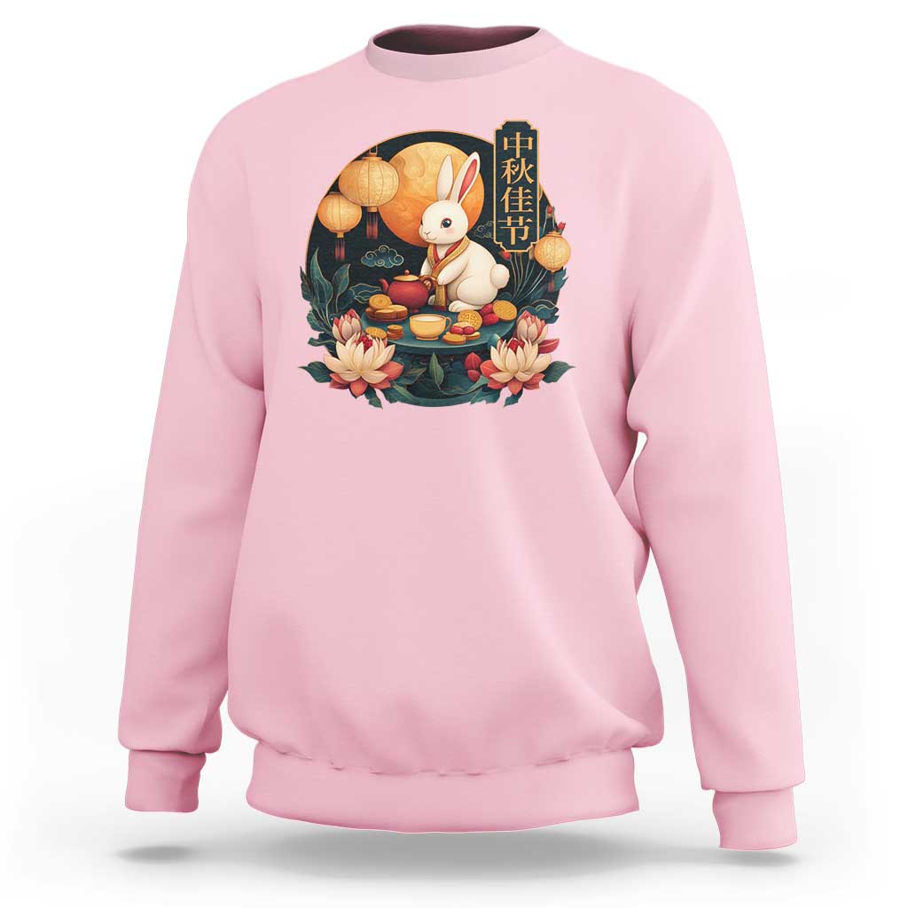 Mid-Autumn Festival sweatshirt, light pink with rabbit and mooncake graphic on chest.