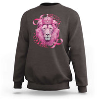 Dark chocolate crewneck sweatshirt with pink lion warrior graphic and crown at center.