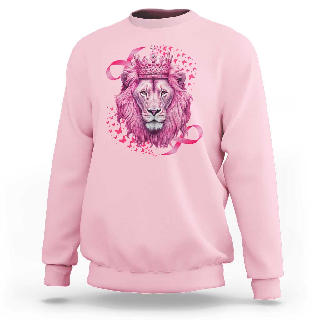 Light pink crewneck sweatshirt with pink lion warrior graphic and crown at center.