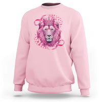 Light pink crewneck sweatshirt with pink lion warrior graphic and crown at center.