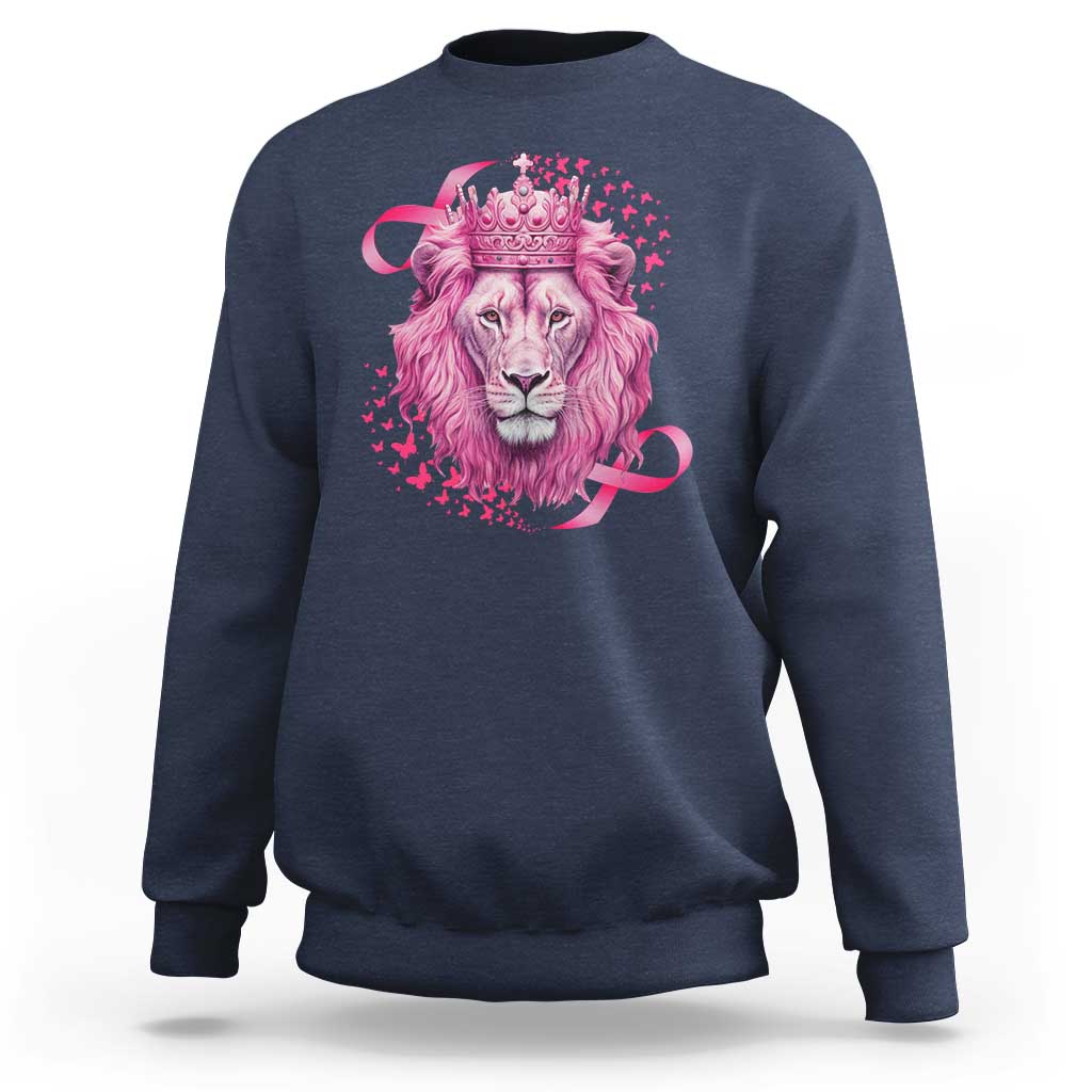 Navy blue crewneck sweatshirt with pink lion warrior graphic and crown at center.
