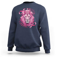 Navy blue crewneck sweatshirt with pink lion warrior graphic and crown at center.