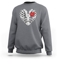 Charcoal gray gothic skeleton sweatshirt with red heart graphic on the front