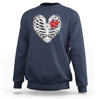 Navy gothic skeleton sweatshirt with red heart graphic on the chest