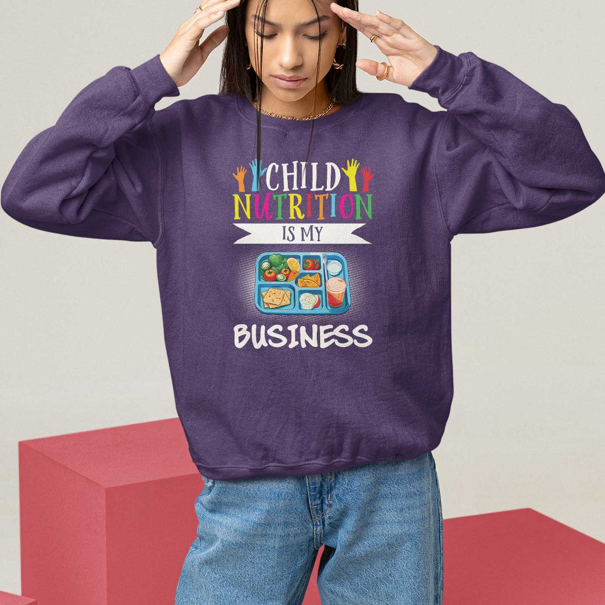 Kids sweatshirt, purple, crew neck, "Child Nutrition Is My Business" front graphic.