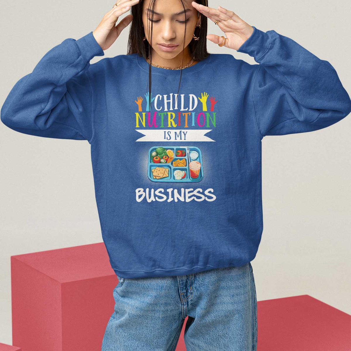 Kids sweatshirt, royal blue, crew neck, "Child Nutrition Is My Business" front graphic.