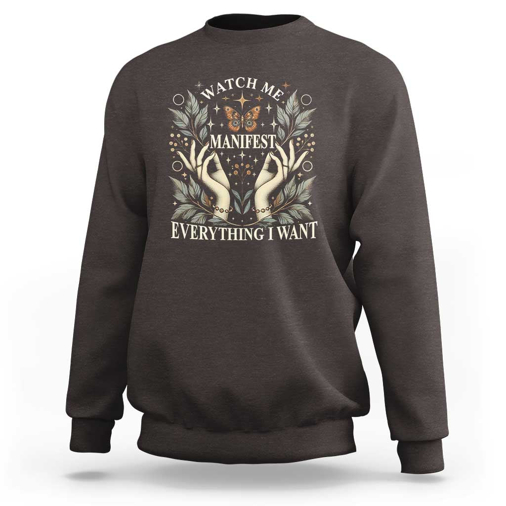 Dark chocolate crewneck sweatshirt with floral hands "Manifest Everything I Want" graphic