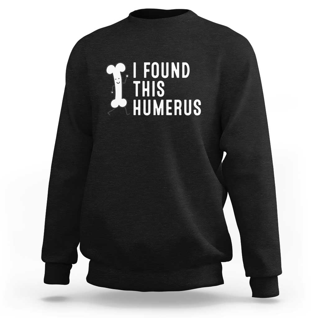 Black dad joke sweatshirt with 'I FOUND THIS HUMERUS' graphic on chest.