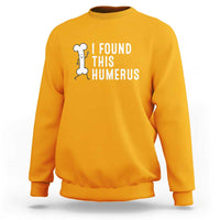 Gold dad joke sweatshirt with 'I FOUND THIS HUMERUS' graphic on chest.