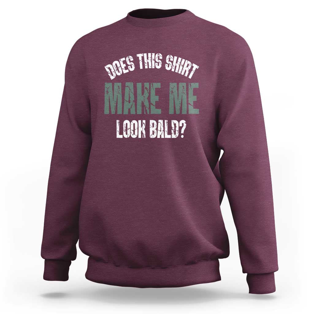 Maroon crewneck sweatshirt with “Does this shirt make me look bald?” graphic