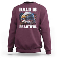 Maroon crewneck sweatshirt with 'BALD IS BEAUTIFUL' eagle graphic