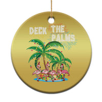Gold round Christmas ornament with “Deck the Palms” and flamingo palm scene