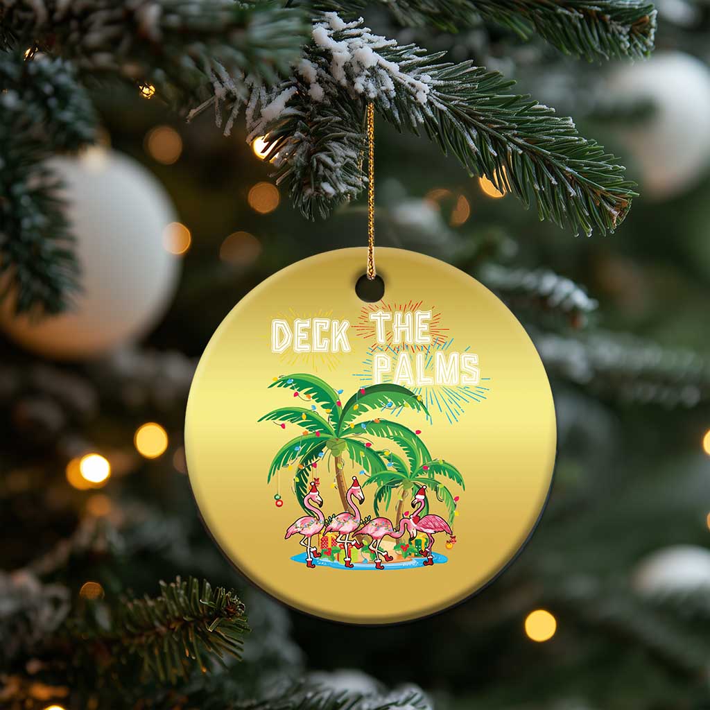 Gold round “Deck the Palms” Christmas ornament with palm and flamingo artwork