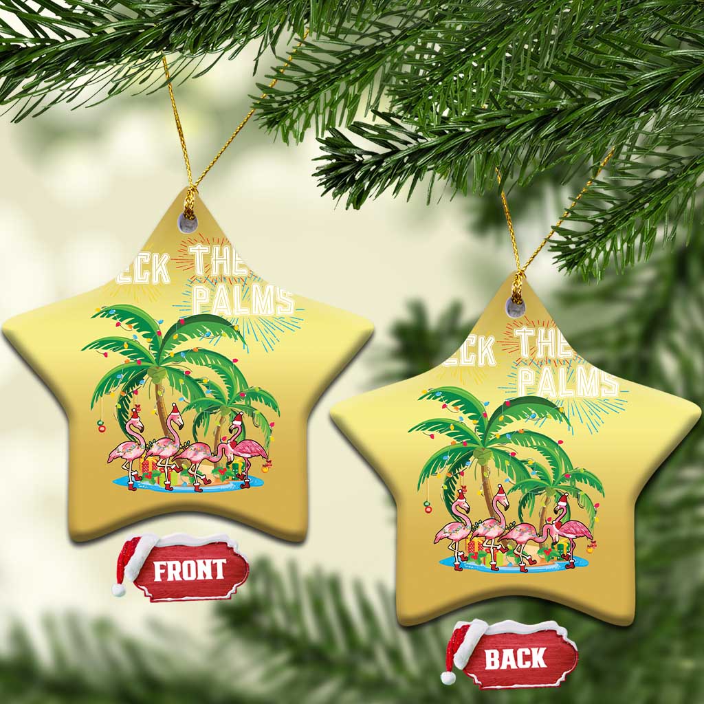 Two gold star-shaped “Deck the Palms” ornaments with flamingo palm scene