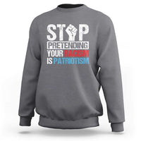Charcoal gray crewneck sweatshirt with bold front 'STOP' graphic and slogan