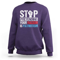 Purple crewneck sweatshirt with bold front 'STOP' graphic and slogan