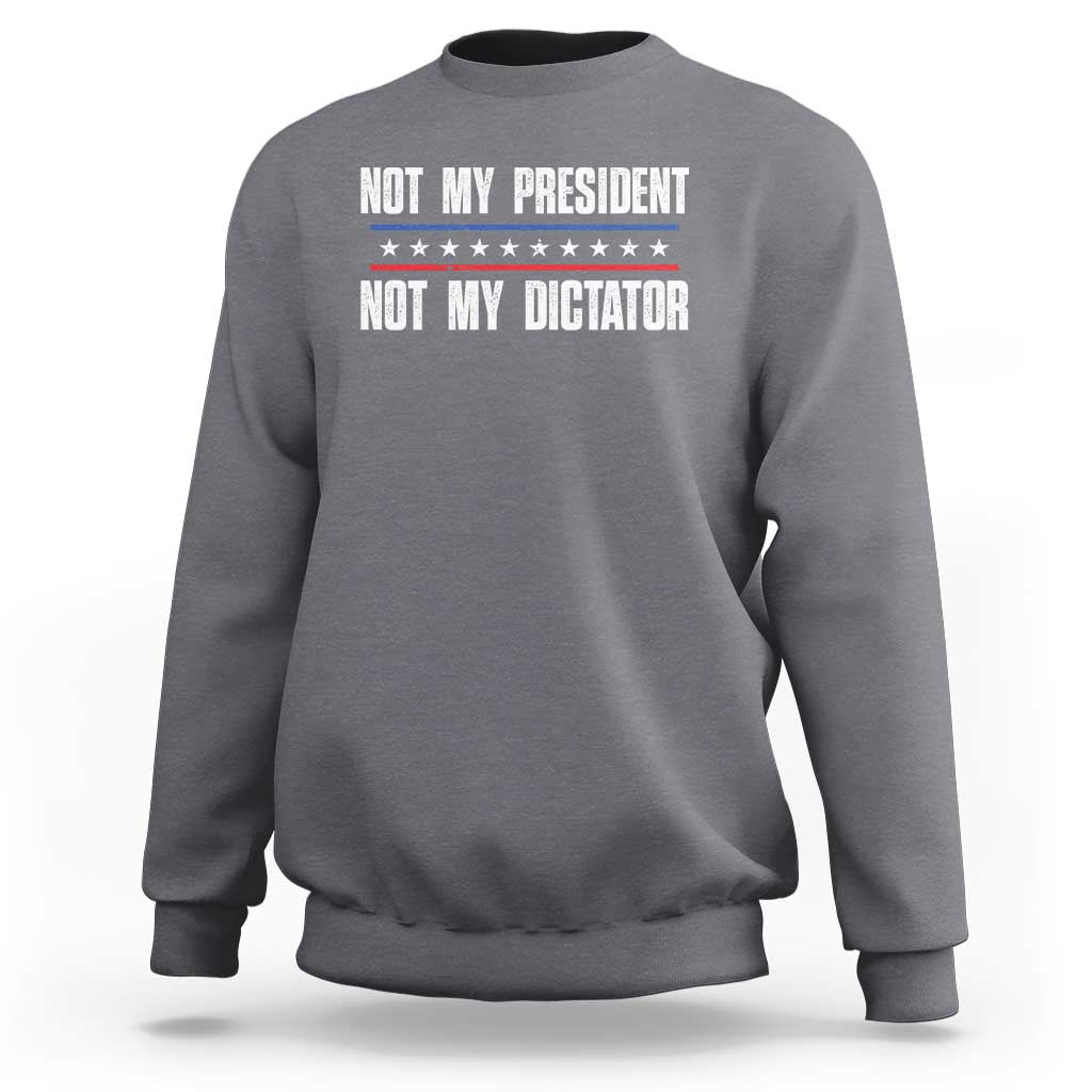 Charcoal gray crewneck sweatshirt with “Not My President / Not My Dictator” front graphic