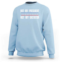 Light blue crewneck sweatshirt with “Not My President / Not My Dictator” front graphic