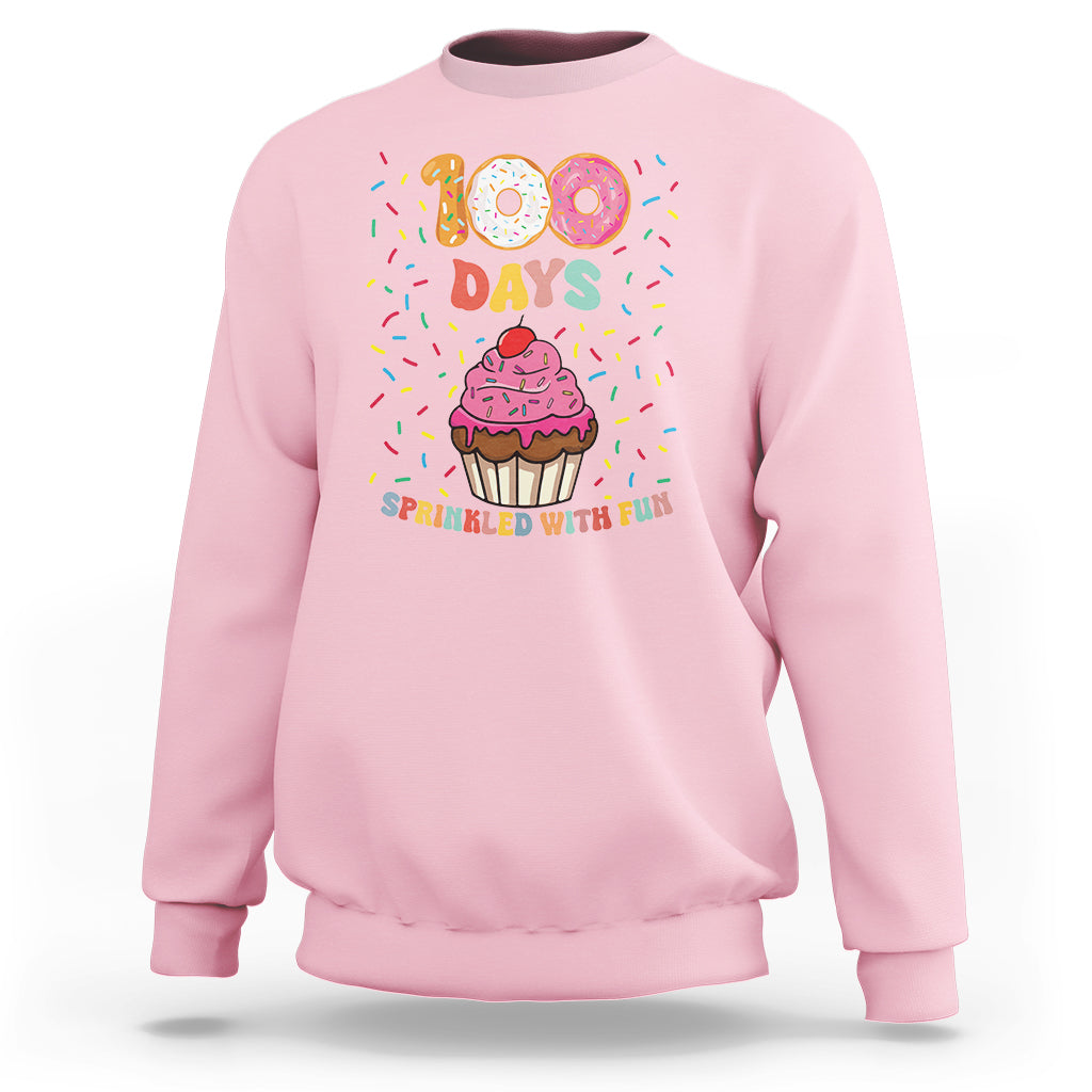 Light pink sweatshirt with 100 Days cupcake graphic, 'Sprinkled with Fun'