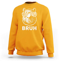 Gold crewneck sweatshirt with capybara wearing sunglasses and 'BRUH' front print